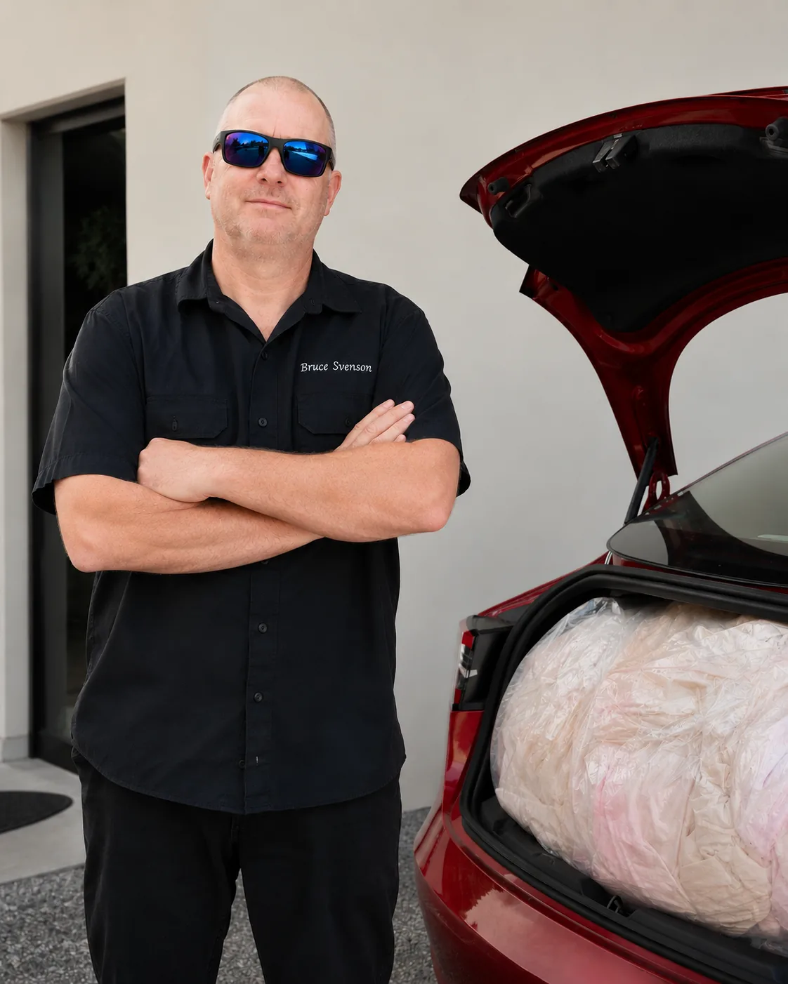 Bruce Svenson from The Washing Club with laundry pickup loaded in car